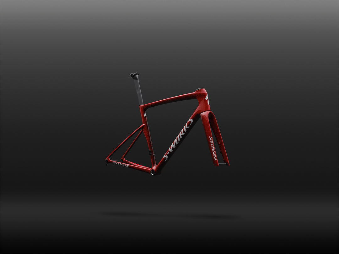 Specialized S-Works Tarmac SL9 road bike frameset in Vivid Red with Tarmac Black detailing and white S-Works graphics, shown in profile against a dark studio background