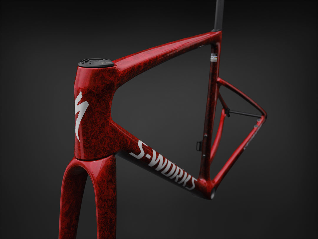 Specialized S-Works Tarmac SL9 road bike frameset in Vivid Red with Tarmac Black detailing and white S-Works graphics, shown in profile against a dark studio background