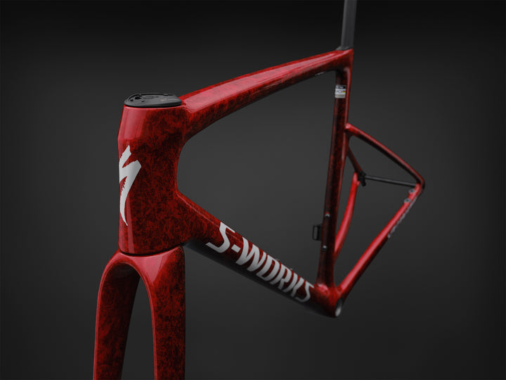 Specialized S-Works Tarmac SL9 road bike frameset in Vivid Red with Tarmac Black detailing and white S-Works graphics, shown in profile against a dark studio background