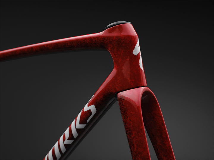 Specialized S-Works Tarmac SL9 road bike frameset in Vivid Red with Tarmac Black detailing and white S-Works graphics, shown in profile against a dark studio background