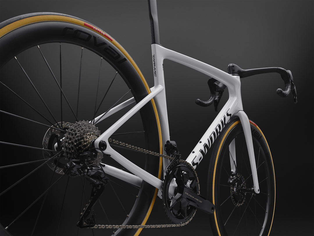 Specialized S-Works Tarmac SL9 road bike frameset in White with S-Works graphics, shown in profile against a dark studio background