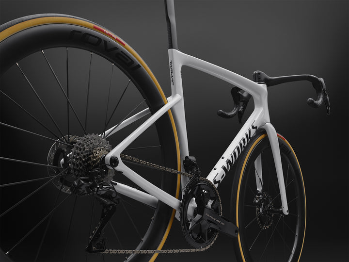 Specialized S-Works Tarmac SL9 road bike frameset in White with S-Works graphics, shown in profile against a dark studio background
