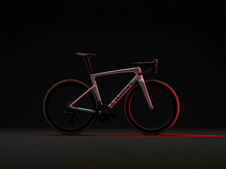 Specialized S-Works Tarmac SL9 road bike frameset in White with S-Works graphics, shown in profile against a dark studio background