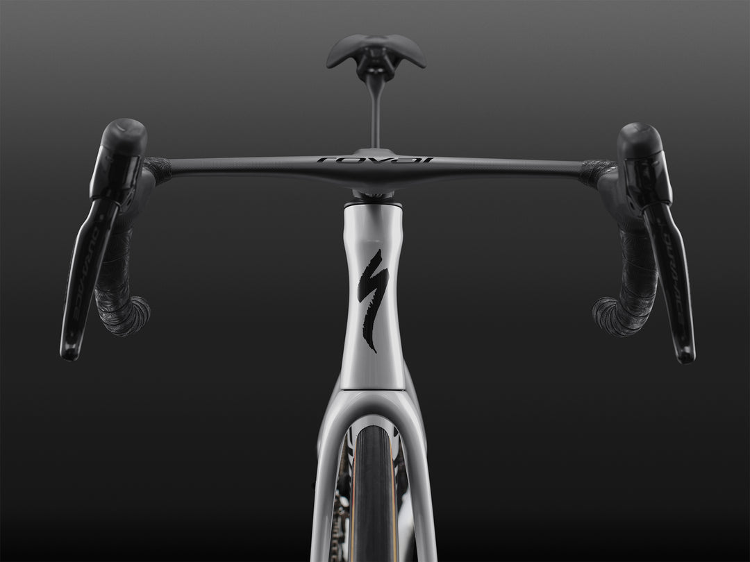 Specialized S-Works Tarmac SL9 road bike frameset in White with S-Works graphics, shown from the front against a dark studio background