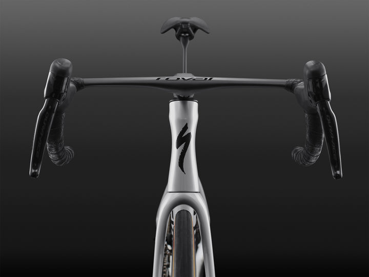 Specialized S-Works Tarmac SL9 road bike frameset in White with S-Works graphics, shown from the front against a dark studio background