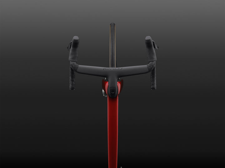 Specialized S-Works Tarmac SL9 SRAM AXS cockpit and stem detail, shown against a dark studio background