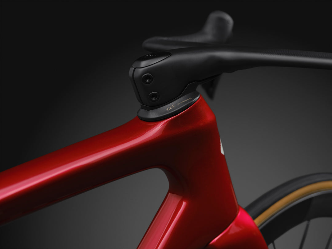 Specialized S-Works Tarmac SL9 SRAM AXS headset detail in Ruby Metallic, shown against a dark studio background