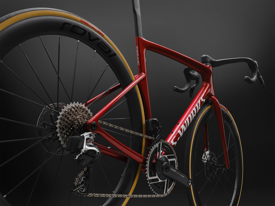 Specialized S-Works Tarmac SL9 SRAM AXS in Ruby Metallic / White Silver Metallic, medium rear three-quarter detail against a dark studio background