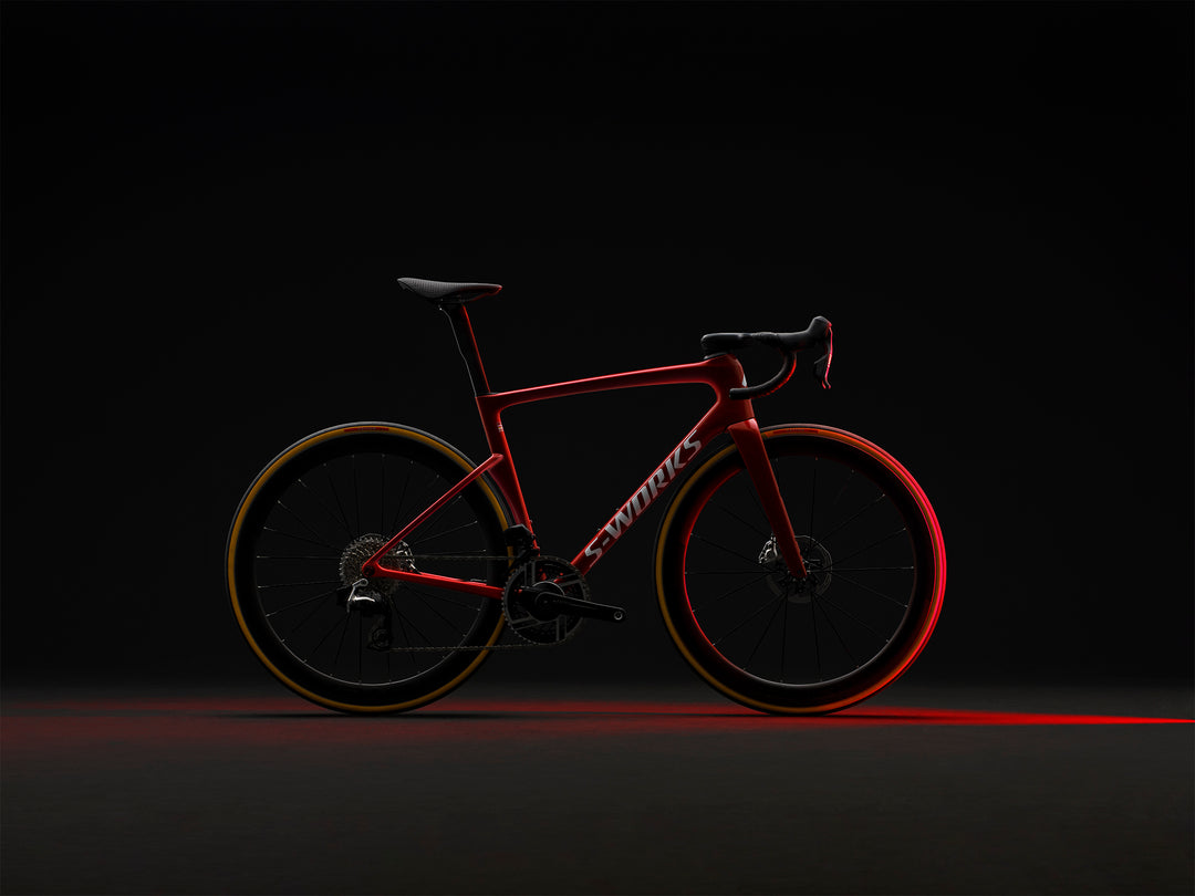 Specialized S-Works Tarmac SL9 SRAM AXS in Ruby Metallic / White Silver Metallic, alternate profile view against a dark background