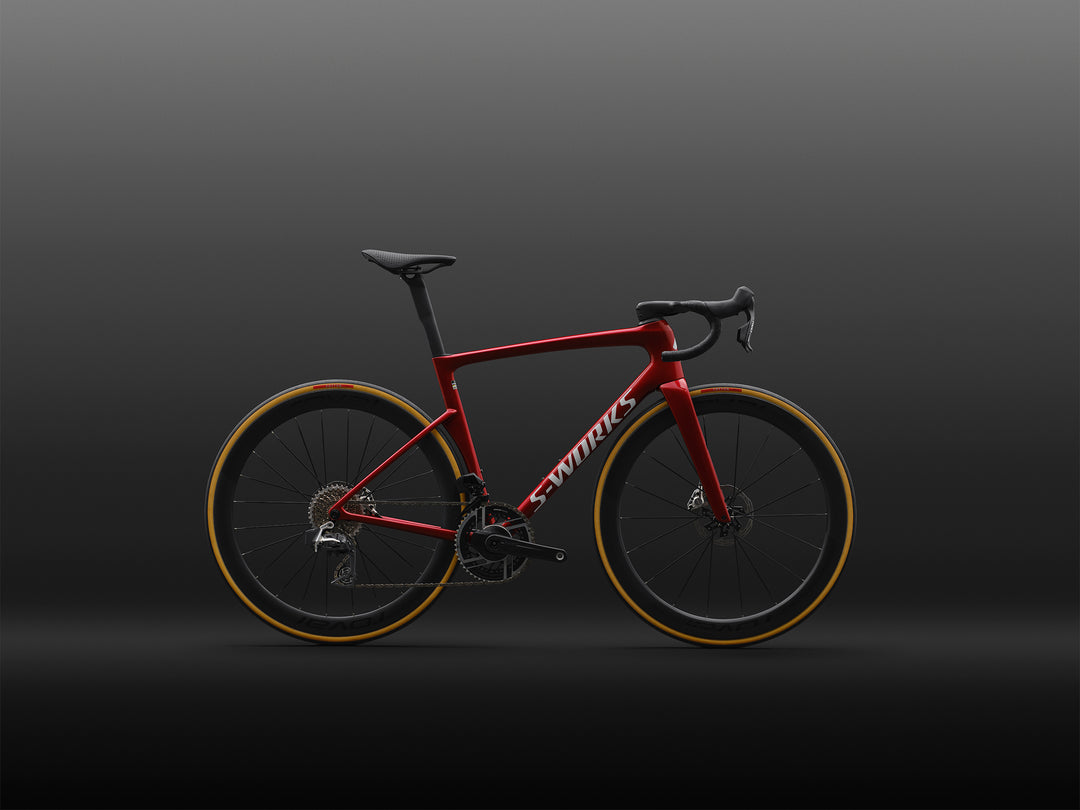 Specialized S-Works Tarmac SL9 complete road bike with SRAM AXS in Ruby Metallic / White Silver Metallic, shown in profile against a dark studio background