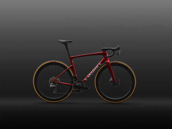 Specialized S-Works Tarmac SL9 complete road bike with SRAM AXS in Ruby Metallic / White Silver Metallic, shown in profile against a dark studio background