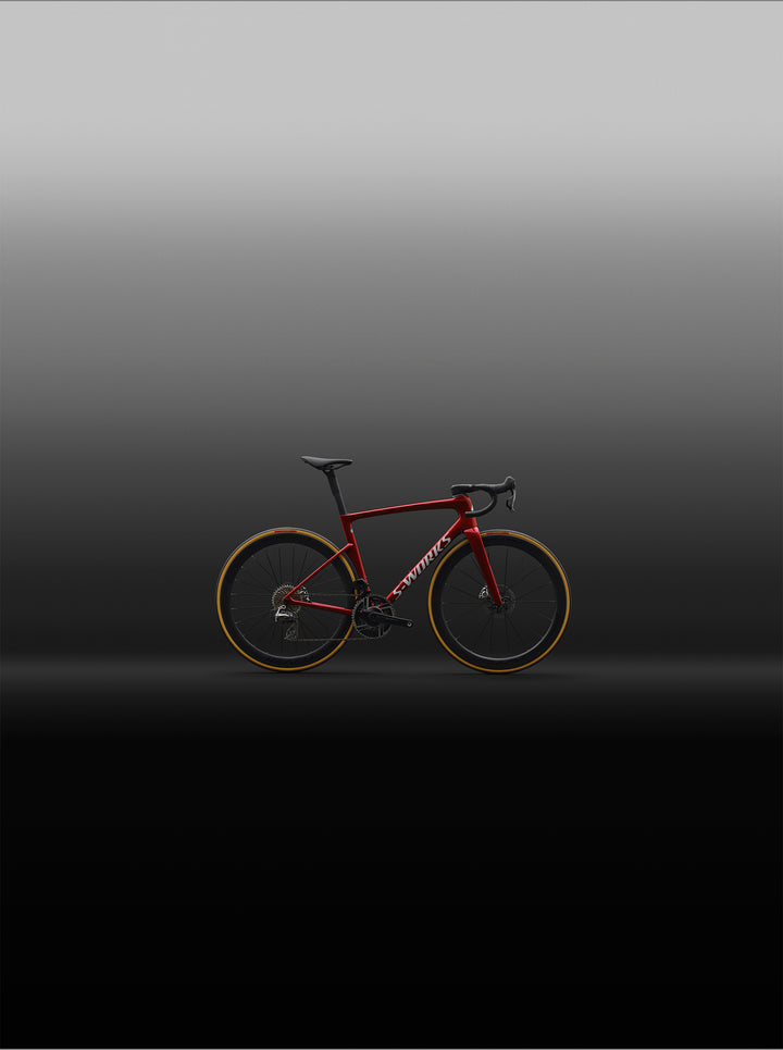 Specialized S-Works Tarmac SL9 SRAM AXS in Ruby Metallic / White Silver Metallic, shown in profile in an outdoor setting