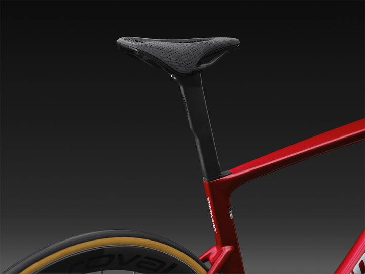 Specialized S-Works Tarmac SL9 SRAM AXS seatpost and seat tube detail in Ruby Metallic, shown against a dark studio background