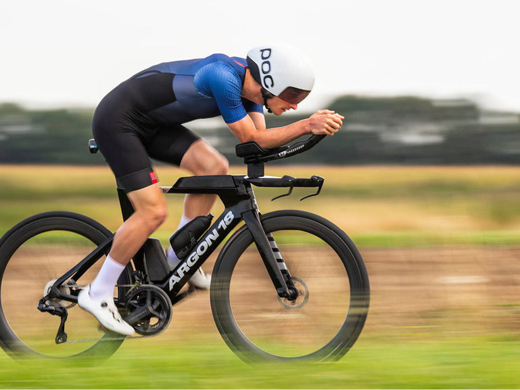 Triathlete riding the Argon 18 E-117 on an open road