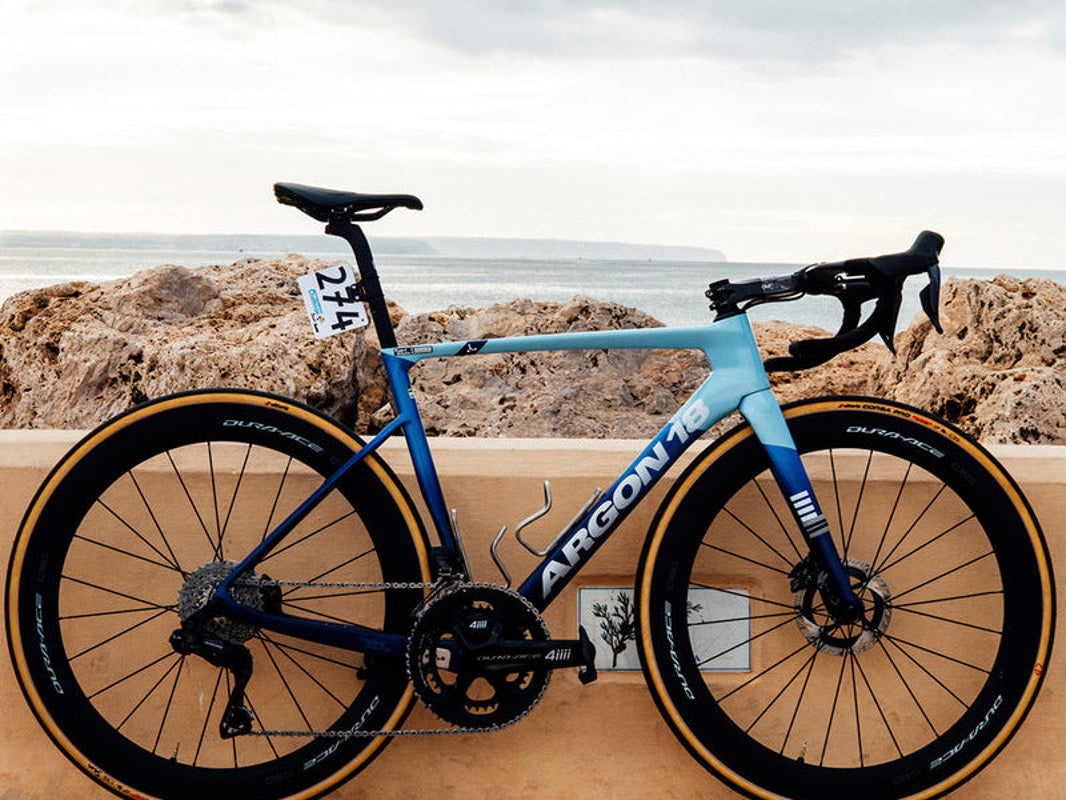 Argon 18 Sum road bike parked on a coastal road