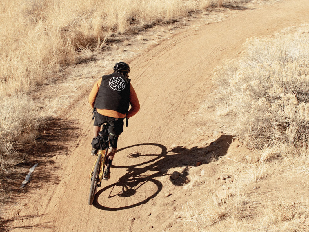 Rider on a Cannondale Topstone on a dusty gravel trail
