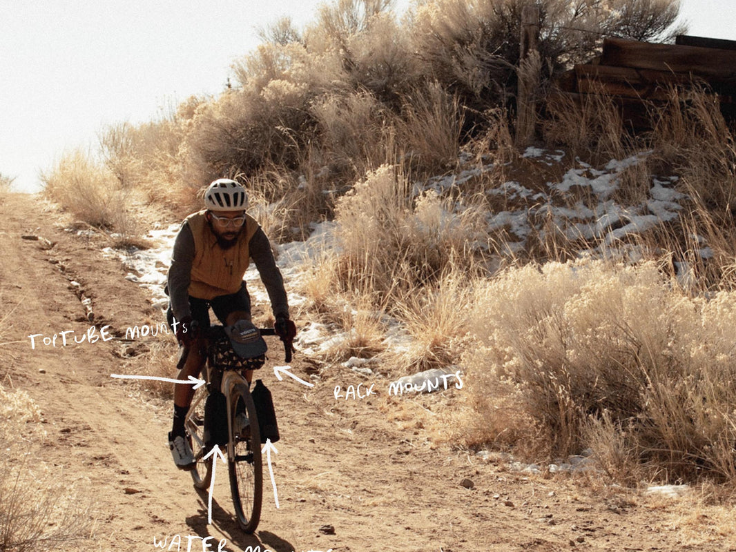 Rider on a loaded Cannondale Topstone in the desert