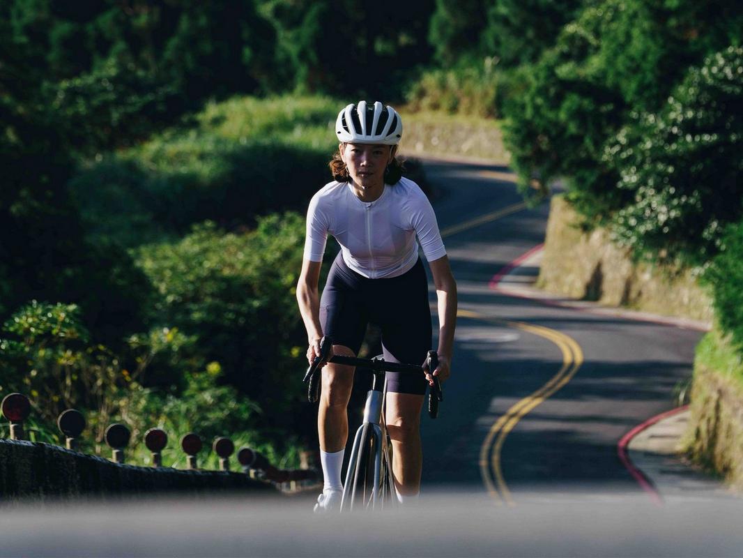 Rider climbing on a Specialized Aethos 2