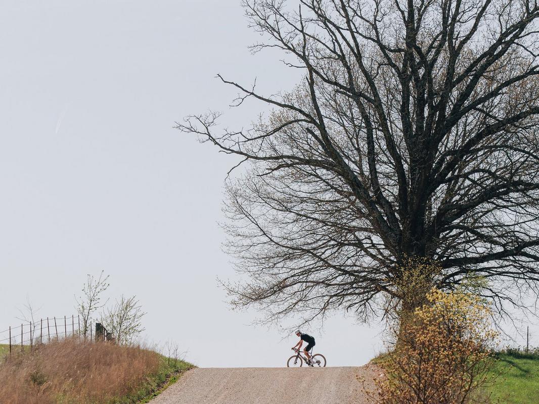 Gravel rider on a quiet country road – the ultimate getaway vehicle